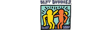 Colorful drawing of two cartoon figures, one yellow and one orange, standing side by side with arms around each other. Text above reads Best Buddies. Below: Since 1989. Light blue background with a black border, perfect for Sunset Music Fest fans.